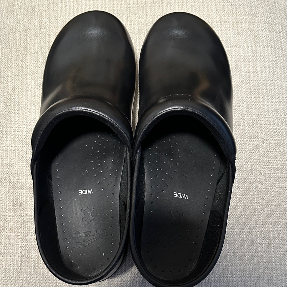 Dansko Women's Black Slip-On Clogs.